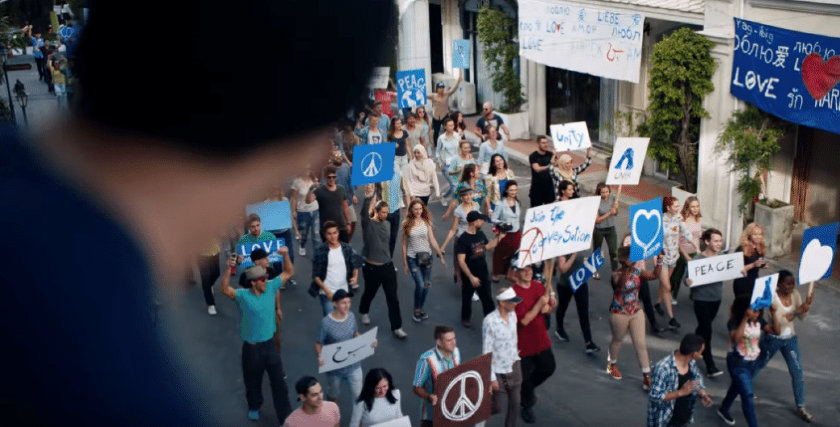 Crowd of protesters in Pepsi ad