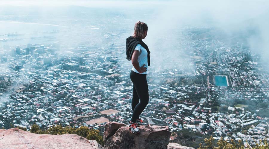 Woman standing on a mountain near Cape Town, South Africa